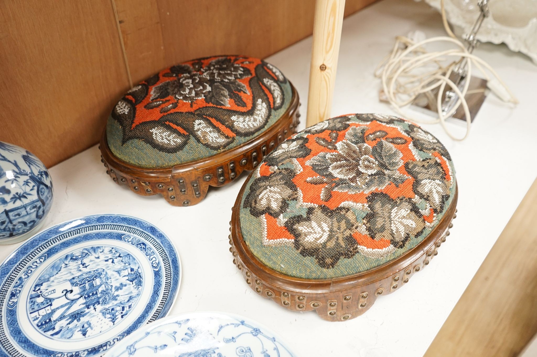 A pair of Berlin beadwork footstools, 38cm